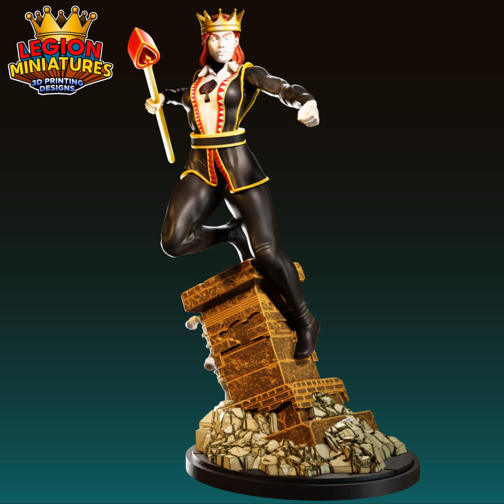 A figurine of a person wearing a crown and holding a scepter, standing on a brick base.