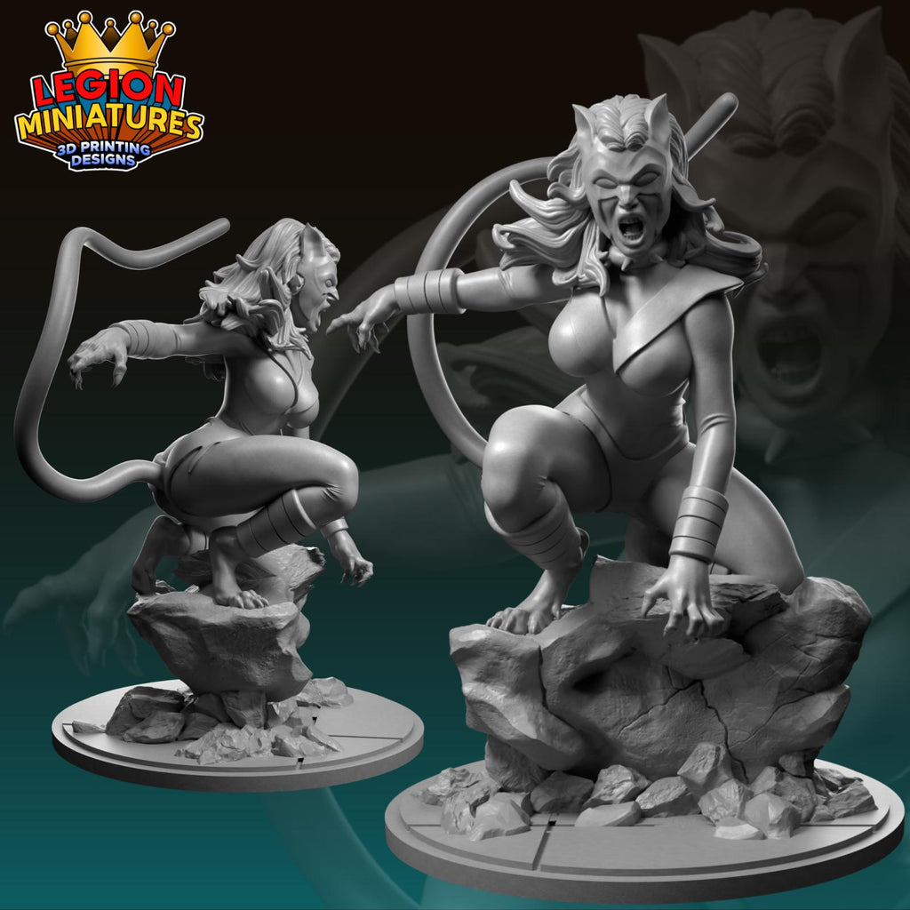 two 3D printed figurines of a female character, one in a crouching position and the other standing on a rock.