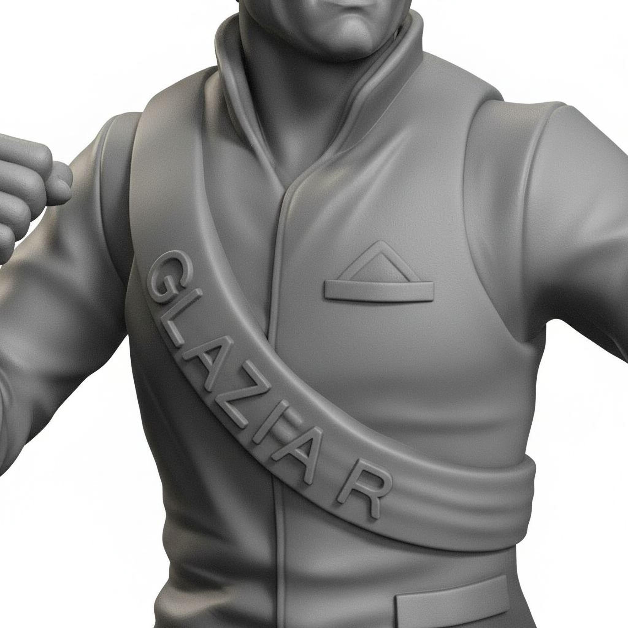 A close-up of a statue or figurine, possibly of a person wearing a jacket with a sash or badge that says "GLAZIER".